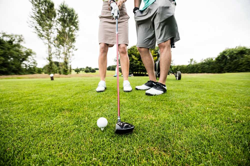 couple playing golf