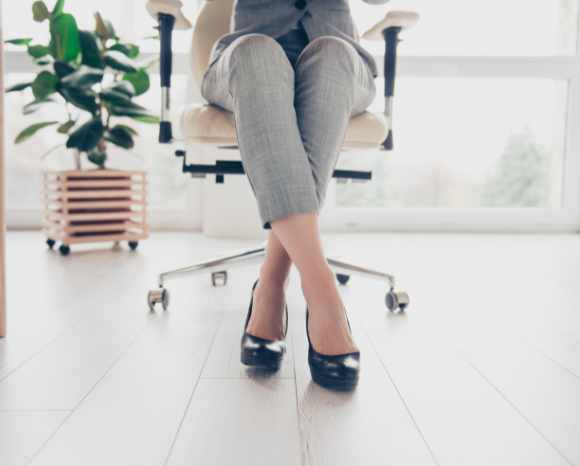 women sitting at desk in office